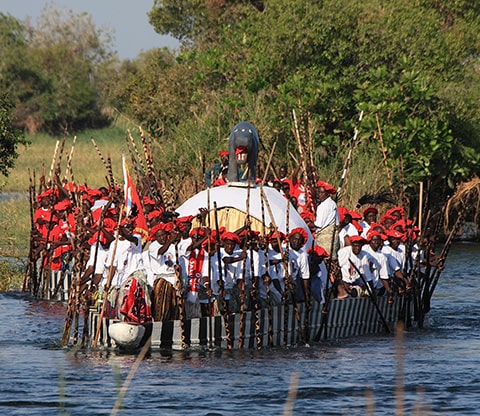 People on a boat during the Kuomboka Festival in Liuwa