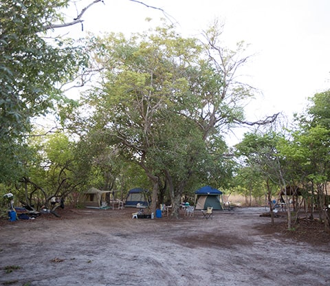 Liuwa campsites with a view of several tents